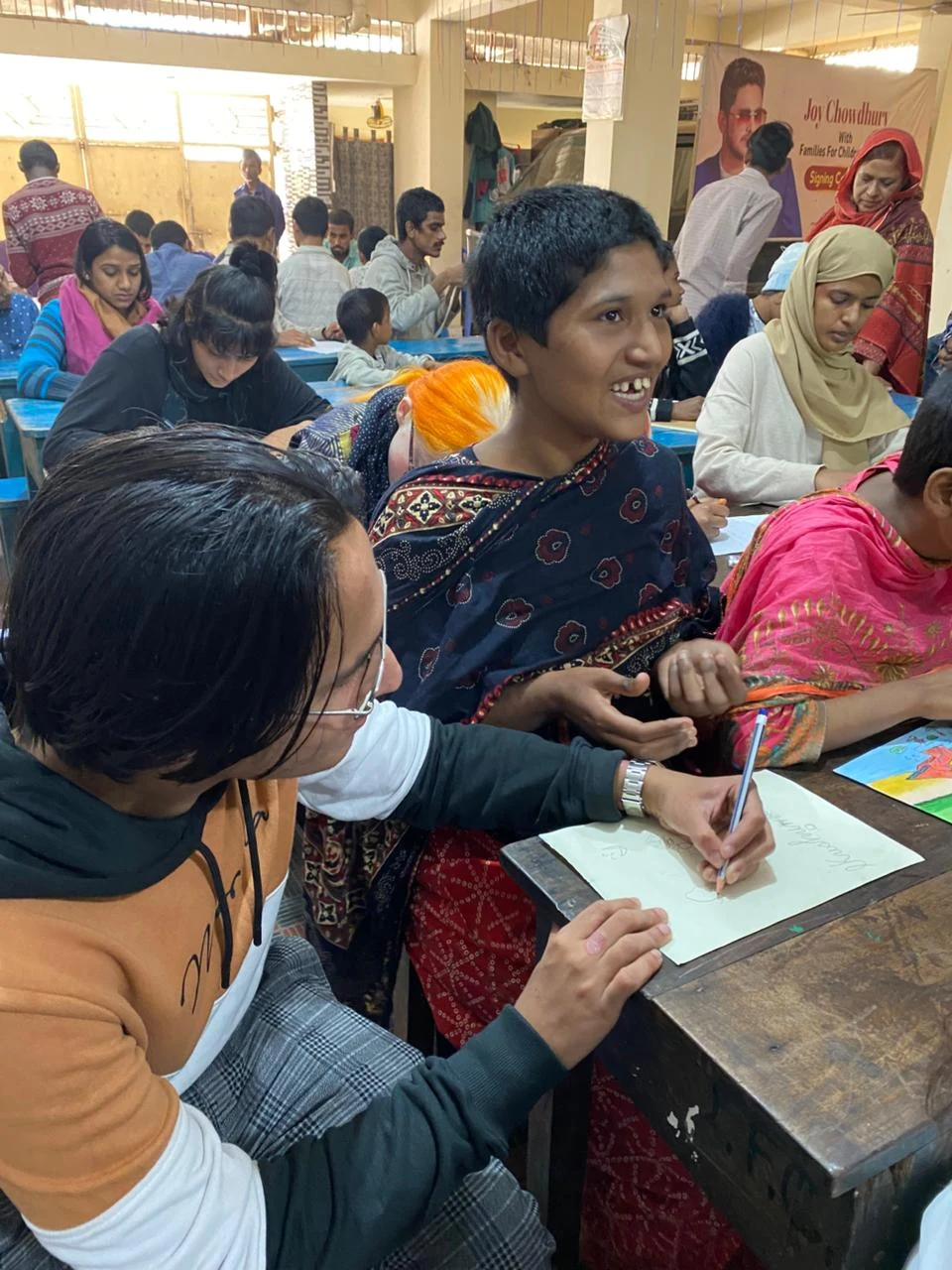 Inclusive Art Celebration - Volunteer Assisting Drawing