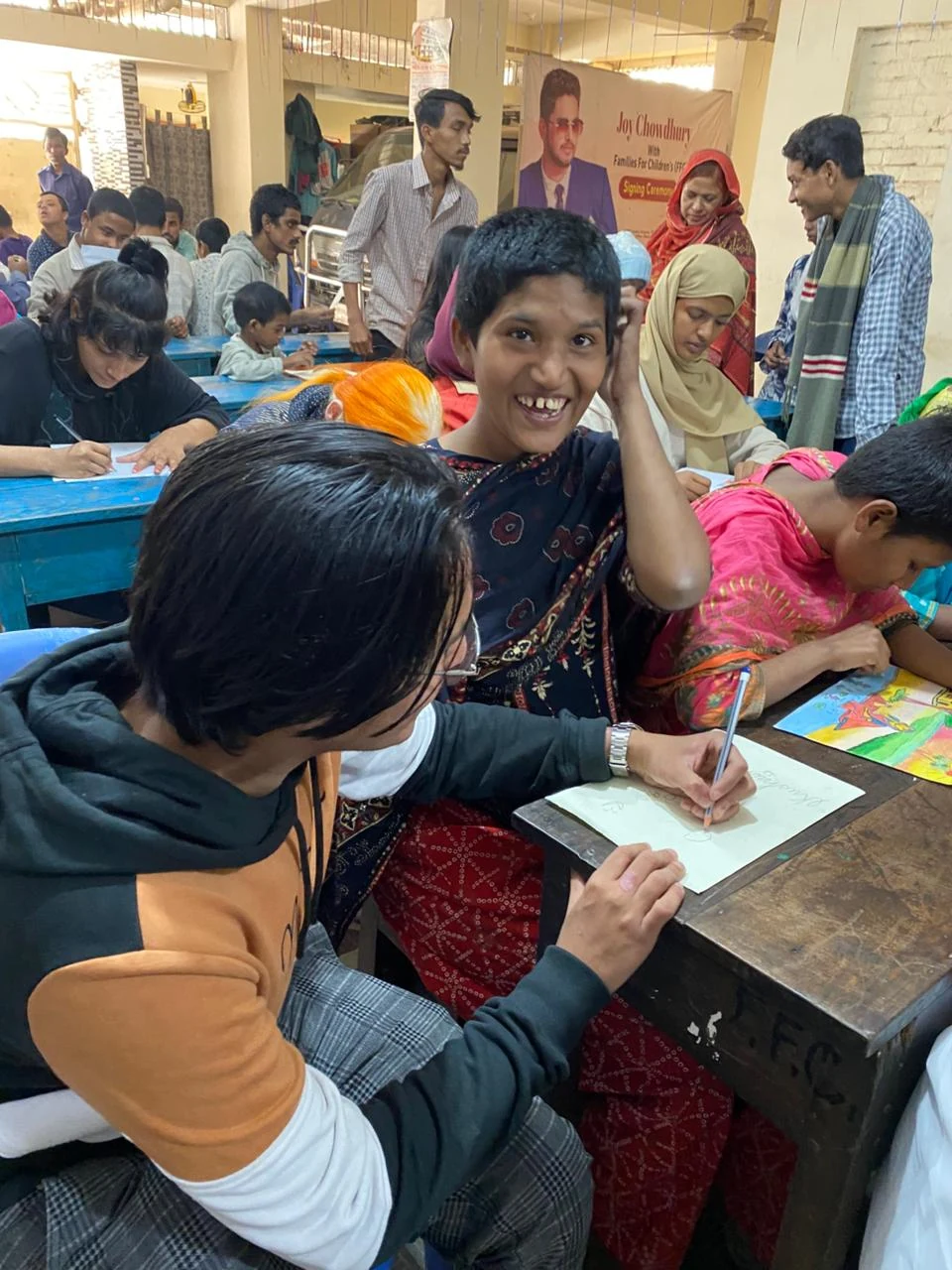 Inclusive Art Celebration - Volunteer Assisting Drawing