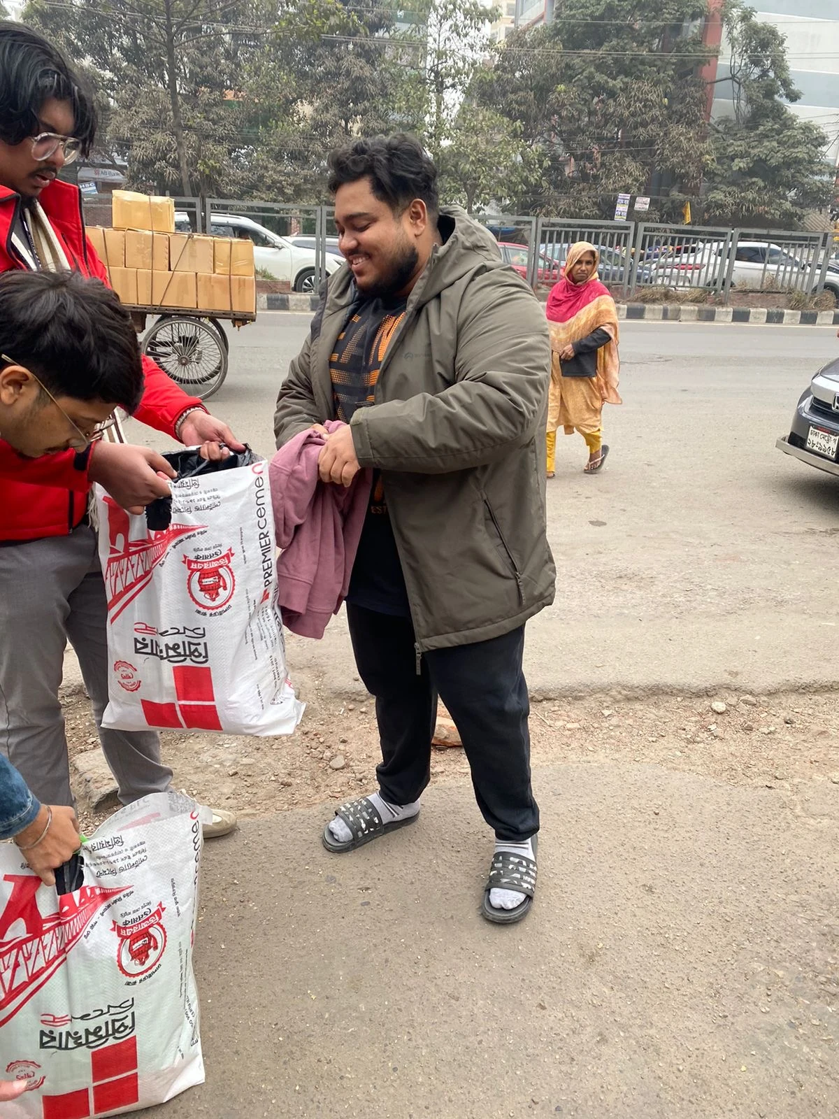 Winter Donation - Volunteers with Bags on Street
